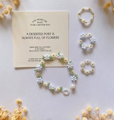 flowers and beads are laid out next to a card that says,'always full of flowers '