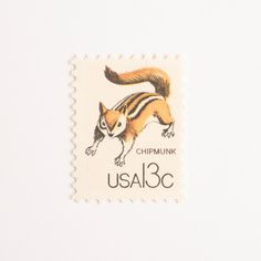 a postage stamp with an image of a chipmunk on it's side