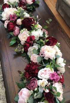 the flowers are lined up on the table to be used as garlands or centerpieces