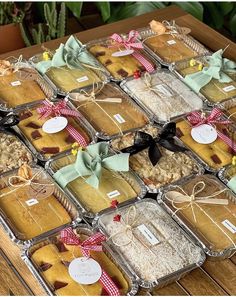 a table topped with lots of trays filled with cookies