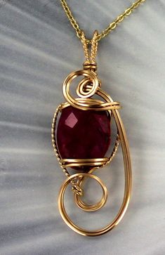 THE BEAUTY OF RED RUBY Amazing 18x13 MM RUBY gemstone----- set in handcrafted 14KT ROLLED GOLD ---- a custom design. gemstone with high detail which cannot be seen in the photograph. The pendant -- Intricate detail that you can see and notice MEASURES 2 inches long Very delicate and intricate in appearance and will get you noticed! One of a kind handcrafted piece of jewelry that anyone will look good in The pendant is absolutely amazing something that you will be proud to wear AAA Quality Gemsto Gold Ruby Fine Jewelry Gemstones, Gold Ruby Gemstones For Anniversary, Gold Wire Wrapped Jewelry For Anniversary, Gold Ruby Jewelry With Polished Finish, Gold Ruby Jewelry For Anniversary, Luxury Gold Ruby Jewelry For Anniversary, Yellow Gold Wire Wrapped Pendant Jewelry, Wire Wrapped Yellow Gold Pendant Jewelry, Unique Gold Gemstones For Jewelry Making