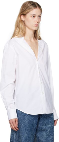 Cotton poplin shirt. · Raw edge at modified Y-neck · Button closure · Shirttail hem · Two-button barrel cuffs · White stitching at back collar · Mother-of-pearl hardware Supplier color: White Classic Johnny Collar Shirt For Daywear, V-neck Shirt With Button Cuffs For Daywear, White Button Shirt, Cotton Poplin Shirt, Mm6 Maison Margiela, Poplin Shirt, Button Shirt, Raw Edge, Cotton Poplin