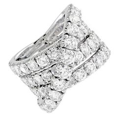 18K White gold magnificent round brilliant cut diamond ring with 7.50 Carats of total weight of Round Diamonds F/G COLOR VS/SI IN CLARITY. Comes with appraisal. Wide Diamond Bands, Crossover Diamond Ring, Brilliant Cut Diamond Ring, Diamond Band Ring, Vintage Style Rings, White Gold Set, Jewels Rings, Diamond Rings Bands, Fashion Ring