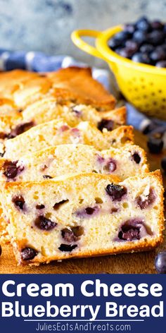 blueberry bread with cream cheese is cut into slices and placed on a cutting board