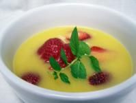 a white bowl filled with fruit and garnish