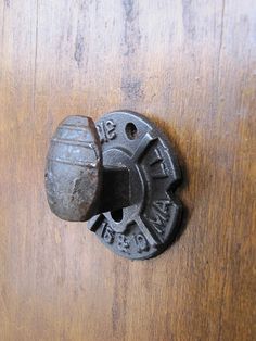 an old door handle with two knobs on it