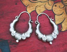 Here we have a pair of nepalese or indian XS - sized 800 silver hoop earrings made  with repoussee technique! I just love them! Easy to wear, as they are hollow.  And they fit very well for every day and for every outfit!  Measurements are: Total length: 28mm (1.1") Outer Diameter: 19mm (0.75") Weight of pair: 4gr. These hoops ship registered priority and with tracking! :-) ❀ Please read my shop and return policies before purchasing ❀ https://www.etsy.com/shop/CosmicNorbu/policy?ref=shopinfo_policies_leftnav Cheap Adjustable Traditional Hoop Earrings, Traditional Adjustable Hoop Earrings, Cheap Silver Bohemian Hoop Earrings, Cheap Traditional Hoop Earrings, Cheap Bohemian Silver Hoop Earrings, Indian Hoop Earrings, Nepali Jewelry, Silver Jewelry Diy, Silver Jewellery Indian