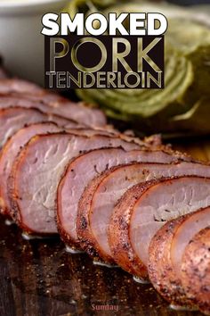 sliced pork on a cutting board next to lettuce and other foods in the background