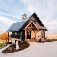 a small house with a porch and covered front door is shown in the country style