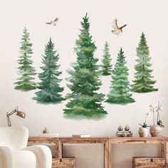 watercolor pine trees with birds flying over them