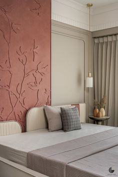 a bedroom with pink walls and white bedding