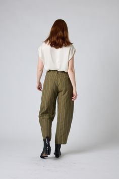 These super flattering pants are a gorgeous addition to your closet. Pair with a plain tee and sneakers for a laid back look, or a stylish blouse and sandals for a more upscale vibe. Wide Leg Hits above the angle Pockets front and back Relaxed Fit in the Leg Fitted Waistline Barrel Leg Pants, Barrel Pants, Androgynous Style, Flattering Pants, Chic Blouses, Stylish Blouse, Plain Tees, Classic Blazer, Work Looks