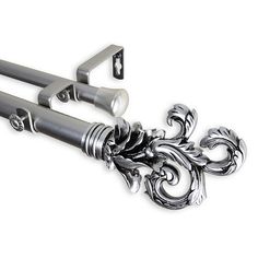 an ornately designed curtain rod with two handles