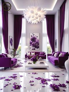 a living room filled with purple couches and flowers on the floor in front of a chandelier