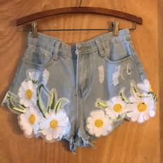 Vintage Floral Embroidered Cut Off Distressed Denim Shorts. Not True To Size. It Runs Small. Tag Says Medium But It Will Fit A Small: Size 2 - 4. Waist: 27". 100% Cotton. Machine Wash Cold. Imported. Pls Ask For Measurements Before Purchasing- Thank You. Medium Wash Floral Embroidered Short Bottoms, Blue Floral Embroidery Cutoff Jean Shorts, Floral Embroidered Denim Jean Shorts, Blue High-waisted Floral Embroidered Jean Shorts, Floral Embroidered Denim Cutoff Shorts, Vintage Jean Shorts, Distressed Denim Shorts, Vintage Jeans, Distressed Denim