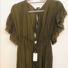 Feminine And Flowy Maxi Dress. New With Tags! Feel Earthy In This “Olive” Hue. Dress Ties Beneath The Bust And Is Accentuated With Small Buttons Up The Center Dress Line. Open “V” Neck Casually Dips In Front And Back, Flattering The Skin. Sweet Flutter Sleeves Give A Renaissance Feeling. Perfect For Baby Bumps But Beautiful And Versatile For All Body Types. This Dress Is Lovely For Summer Or Fall! Wear With A Denim Jacket Or Corduroy Blazer And Boots On Cooler Days Or Nights. “Anika Flutter Sleeve Dress” Chic Olive Dress For Spring, Elegant Olive Maxi Dress For Summer, Olive Dress For Summer Daywear, Chic Olive Dress For Day Out, Chic Flutter Sleeve Dresses In Rayon, Chic Rayon Dress With Flutter Sleeves, Olive Summer Dress For Daywear, Olive Summer Dress For Brunch, Chic Green Mini Dress With Flutter Sleeves