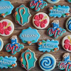 decorated cookies are arranged on a wooden table