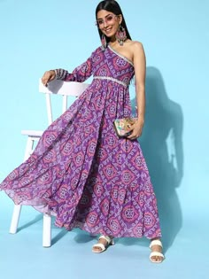 Add a touch of class to your style with this sophisticated dress. Designed with attractive ethnic motifs and charming one-shoulder, this dress will make you stand out. Pretty purple colourEthnic motifsOne-shoulderLong regular sleevesPolyester, dry clean Bandhani One Piece Dress, One Shoulder Dress Indian Gown, Purple Printed Dress, Bandhani Long Dress, One Shoulder Indo Western Dresses, One Shoulder Ethnic Dress, Traditional One Shoulder Party Dress, Traditional One-shoulder Festive Dress, Traditional One-shoulder Party Dress