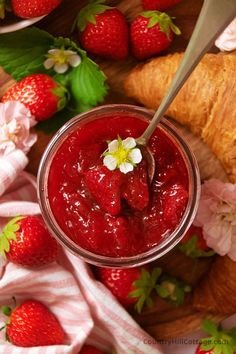 strawberries and croissants on a wooden table