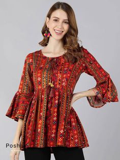 Red Printed Tie-up A-line Tunic Top /Kurti For Women Short Kurta For Women- This outfit is made with the finest Rayon of India. The set contains : 1 Kurti Kurti: Red printed A-line top kurti/tunic comes with a tie up neck ,flared hem, gotta patti details. Sleeve length : 3/4 Bell Sleeves Material : Kurti : Rayon Fabric Care : Machine wash Front length : 31 inches Please see the photo section to choose a perfect size for yourself. *Please note the color of the item may slightly vary due to differ Cotton Short Tops, Indian Tunic Tops, Kurti Style, Printed Peplum Top, Gotta Patti, Simple Kurta Designs