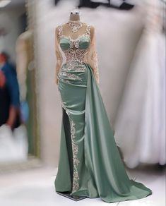 Long Sleeve Dresses For Wedding And Prom Season, Green Gown With Sweep Train, Green Sweep Train Gown, Green Dresses With Sweep Train For Banquet, Green Dress With Sweep Train For Banquet, Green Floor-length Dress With Sweep Train, Fitted Dress With Long Train For Banquet, Fitted Bodice Sheath Dress For Prom, Fitted Long Sleeve Dress With Sweep Train