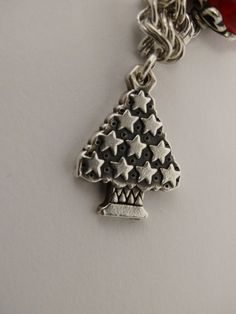 The James Avery Christmas Tree is made with solid sterling silver featuring 10 perfect 5 corner stars, size 25 x 17mm wide in excellent condition. Christmas Festive Silver Charm Bracelet, Christmas Star Charm Jewelry Gift, Silver Christmas Festive Bracelets, Silver Holiday Bracelet, Festive Silver Bracelets For Christmas, Silver Bracelets For Christmas Festive Season, Silver Star Charm Bracelet Gift, Silver Bracelet For Holiday, Silver Bracelets For Holiday