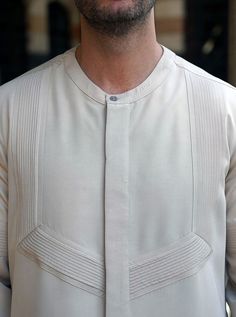 Classic Fitted Cotton Kurta, Classic Fitted Kurta For Semi-formal Occasions, Classic Cotton Kurta For Semi-formal Occasions, Elegant Fitted Kurta With Pintucks, Spring Long Sleeve Kurta With Pintucks, Spring Long Sleeve Pintuck Kurta, Classic Fitted Long Sleeve Kurta, Formal Long Sleeve Beige Kurta, Fitted Long Sleeve Pintuck Top