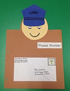 a postal worker's hat on top of a piece of cardboard