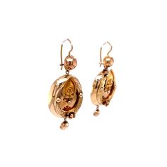 Vintage Victorian Drop Earrings 14k Yellow Gold. These whimsical 14 karat yellow gold Victorian earrings are so special. The oval drop earring features a floral motif with repousse relief metal work detail. The earrings are rather large for the time period, measuring over 2 inches in length and have great movement. Victorian earrings are sought after by many collectors as they have remained a pair for over 140 years. Antique Yellow Gold Drop Earrings, Victorian Oval Pierced Earrings, Victorian Oval Filigree Earrings, Victorian Filigree Oval Earrings, Ornate Yellow Gold Oval Earrings, Victorian Style Engraved Yellow Gold Earrings, Victorian Engraved Yellow Gold Earrings, Antique Engraved Drop Earrings, Antique Gold Earrings With Screw Back