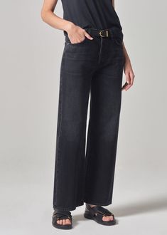 This trouser inspired silhouette is designed to sit high on the waist with a flattering, ultra-relaxed wide-leg. This easy-going staple offers a full length 30” inseam. Style yours with a sleek bodysuit or a classic t-shirt and blazer. For extra length, try the Annina Long 33”. This fit is true to size. Looks Like: Saturated blackFeels Like: Midweight non stretch organic cotton From our HUMANITY Collection Citizens Of Humanity, Trouser Jeans, Classic T Shirts, Full Length, Wide Leg, Organic Cotton, High Rise, Sleek, Trousers