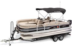 a white and black pontoon boat on trailer