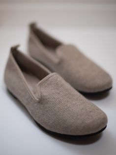 These luxury slippers might be the perfect way to start and end your day. Like a warm hug, the soft, silky 100% cashmere knit, and plush inner cushion surround your feet in deeply satisfying comfort. Mornings become instantly cozier, nights become more soothing and restorative, and the sweet suede detailing keeps the style sleek and attractive. And with a convenient rubber sole for short trips to the mailbox, you can enjoy this comfy pair inside and out. Available in Oyster, Taupe, Gray, and Bla Luxury Leather Comfortable Slip-ons, Cozy Beige Slip-on Slippers, Cozy Slip-on Slippers With Soft Texture, Cozy Soft Texture Slip-on Slippers, Slip-on Soft Slippers For Relaxation, Soft Slip-on Slippers For Relaxation, Soft Slip-on Slippers For Loungewear, Beige Slip-on Comfortable Slippers, Comfortable Soft Slippers For Fall