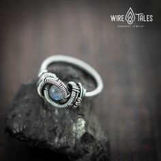 Unique bohemian style wire wrapped Silver filled Ring with natural Moonstone gemstone The ring wrapped with silver filled copper wire that has a 10% plating of silver. It was oxidized to create antique look and to highlight the details of the wire work. Ring size US: 7 If you want different size, please don't hesitate to contact me, I will make a similar ring with the size you want :) ----- How to measure size of your ring size: https://www.wikihow.com/Find-Your-Ring-Size All my jewelry is caref Adjustable Bohemian Moonstone Ring In Sterling Silver, Adjustable Wire Wrapped Moonstone Ring, Bohemian Sterling Silver Hand Forged Moonstone Ring, Bohemian Hand-forged Sterling Silver Moonstone Ring, Bohemian Hand Forged Moonstone Ring In Sterling Silver, Bohemian Hand Forged Sterling Silver Moonstone Ring, Hand Forged Adjustable Bohemian Rings, Adjustable Hand Forged Bohemian Rings, Hand Wrapped Bohemian Sterling Silver Ring