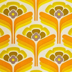 an orange and yellow flower pattern on fabric