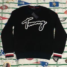 Mens Medium New With Tags Fall Streetwear Street Wear Supreme Fashion Style Colorful Logo Spellout Spell Out Tommy Hilfiger Black Crew Neck Top, Tommy Hilfiger Winter Sweatshirt With Ribbed Cuffs, Tommy Hilfiger Sporty Black Tops, Tommy Hilfiger Winter Streetwear Tops, Tommy Hilfiger Black Tops For Fall, Black Tommy Hilfiger Tops For Fall, Tommy Hilfiger Black Long Sleeve Top, Casual Tommy Hilfiger Winter Tops, Casual Tommy Hilfiger Tops For Winter