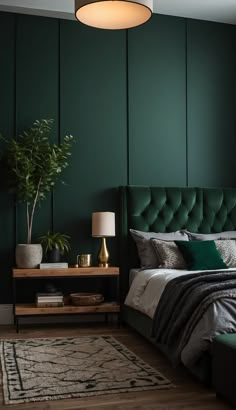 a bedroom with dark green walls and a bed in the middle, along with a rug on the floor