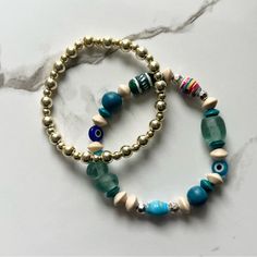 This Stack Includes Multi-Toned Blue Evil Eye Bracelet And A Gold Stacker. 7” But Can Be Adjusted Upon Request Ready To Ship! Tiffany And Co Bracelet, Twisted Bangle, Stretchy Beaded Bracelet, Faux Pearl Bracelet, Wide Cuff Bracelets, Small Bracelets, Gems Bracelet, Bangle Bracelet Set, Handcrafted Bracelets