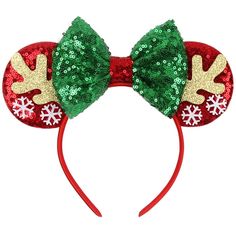 a red and green minnie mouse ears headband with christmas decorations on the ears,