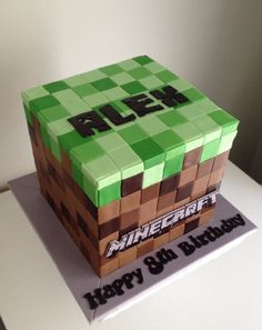 a birthday cake made to look like a minecraft block