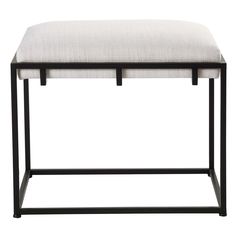 an upholstered bench with black legs and a white cushion