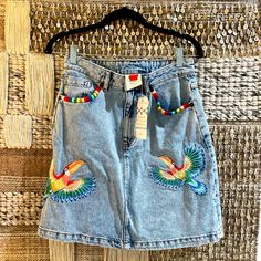 A-Line Mini Shape, Light-Colored Denim. Detailed Multicolor Parrots Embroidered On Each Side At Front, As Well As Coordinating Embroidery At Front Side Pocket Trim Embroidered Denim, Farm Rio, Colored Denim, Denim Mini, Denim Mini Skirt, Side Pocket, Mini Skirt, Anthropologie, Womens Skirt