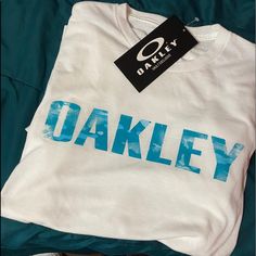 Brand New Branded Blue Summer Tops, Summer Blue Tops With Branding, White Summer Shirt With Branding, Blue Logo Print Shirt For Spring, Blue Shirt With Logo Print For Spring, Oakley Men, White Blue, Blue White, Color Blue