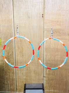 "These adorable southwestern beaded hoop earrings are hand made in the USA.  Add a little bit of fun to your wardrobe ladies!  These earrings are the perfect accessory for a night out on the town or with a pair of your favorite jeans.  This earring is a great gift for any woman.  The earring is length 2 1/2\" and 2 1/4\" wide" Bohemian Heishi Beads Small Hoop Earrings, Bohemian Small Hoop Beaded Earrings With Ear Wire, Bohemian Beaded Small Hoop Earrings With Ear Wire, Adjustable Circle Earrings For Summer, Bohemian Small Hoop Heishi Bead Earrings, Summer Tiny Beads Small Hoop Earrings, Summer Adjustable Circle Earrings, Summer Tiny Beaded Small Hoop Earrings, Nickel-free Small Hoop Beaded Earrings For Summer