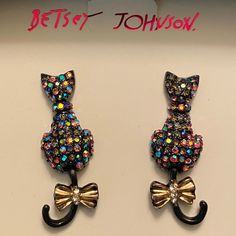 Betsey Johnson Pave Iridescent Crystal Stones Cat Swinging Tail Drop Earrings They Are New In The Box - A Very Cute Halloween Gift Box Cute And Sparkly Mixed Metal Post Back Closure The Cats' Tails Move Color Is Black Multi-Colored, And Goldtone Each Measures About 1.5" Tall By 0.5" Wide Smoke-Free Home Tm10 Elegant Party Jewelry With Cat Design, Elegant Cat Design Jewelry For Party, Betsey Johnson Alley Cat, Dangly Gummy Bear Earrings Betsey Johnson, Angel Wings Necklace Betsey Johnson, Betsey Johnson Novelty Bags, Metal Post, Betsey Johnson Earrings, Betsey Johnson Necklace