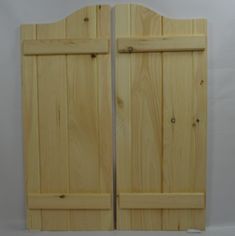 two wooden doors are shown against a white background, one is closed and the other has been made out of wood