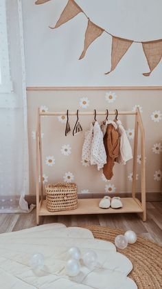 Looking for a wonderful storage option for kids? Our teepee clothes rack is an amazing way to accentuate a particular part of a playroom, nursery, or any other space. The reason why the Montessori kids wardrobe is ideal for little fashionistas is that it has a hang bar at the top and a shelf at the bottom. You can easily hang up the clothes of your little ones, place storage baskets, and add a bit of style and comfort to the room.  Made of the highest quality birch plywood, the clothes rack for baby is environment-friendly and safe for your little cherub. Simple wooden children's clothing rack is a perfect tool for parents looking for ways to promote self-independence in kids. Besides, the rack will become your personal helper when it's time to start encouraging the child to (un)dress them Children Closet, Wooden Clothing Rack, Dress Up Corner, Rack Wardrobe, Dress Up Storage, Kids Hangers, Montessori Room, Kids Closet, Nursery Closet