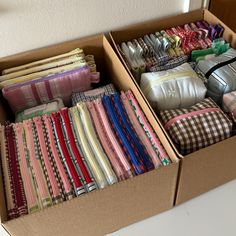 two boxes filled with different types of cloths