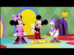 mickey and minnie mouse dancing on the floor