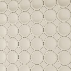 a white wall with circles on it