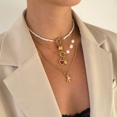 Our Allegra Necklace features a textured cable chain with O-ring to center with initial and mini freshwater pearl charms. Elegantly designed, this necklace makes a special personalised gift for a loved one or addition to your own collection. 18k gold plated stainless steel + freshwater pearls Length: 18" + 2" extender (can be made shorter, please leave desired length in 'order notes' section at checkout) Tarnish and sweat resistant Hypoallergenic no green skin 1 year warranty Woman Necklace, Green Skin, Necklace Elegant, Jewelry Lookbook, Pearl Charms, How To Make Shorts, Pearl Choker, Style Guide, Faceted Bead